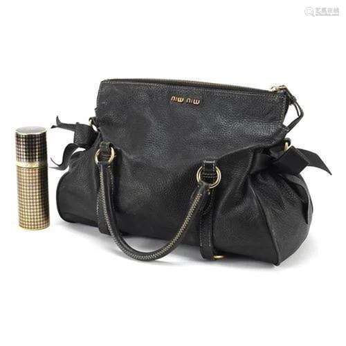 Miu Miu black leather bow bag and Chanel perfume