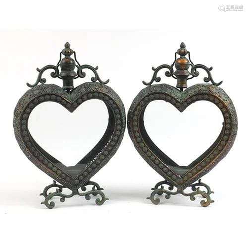 Pair of ornate bronzed metal love heart candle holders with ...