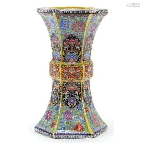 Chinese porcelain vase decorated in the famille rose palette...