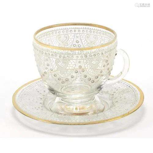 Continental glass cup and saucer with enamelled decoration, ...