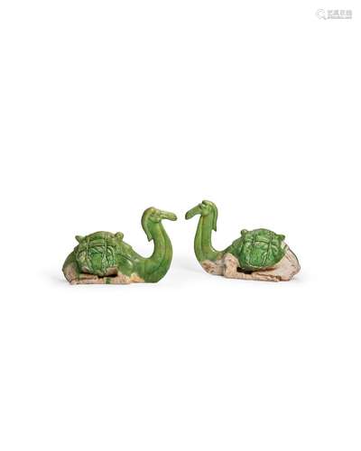 AN EXTREMELY RARE PAIR OF GREEN-GLAZED POTTERY FIGURES OF SE...