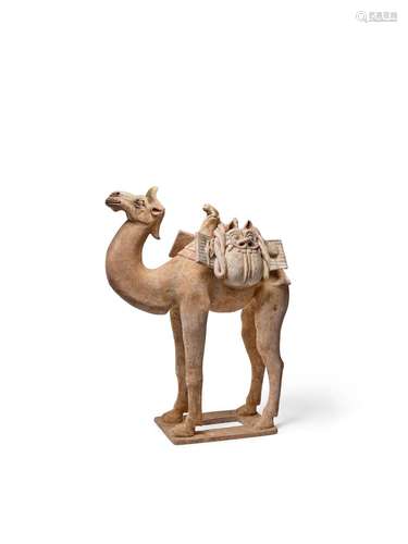 A MASSIVE AND RARE BUFF POTTERY FIGURE OF A CAMEL AND MONKEY...