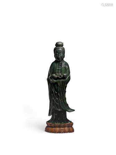 A Massive and imposing Spinach-green jade figure of Guanyin ...