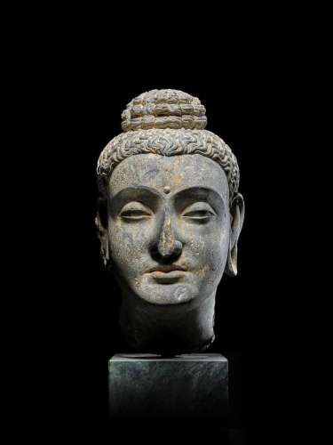 A SCHIST HEAD OF BUDDHA  ANCIENT REGION OF GANDHARA, 3RD/4TH...