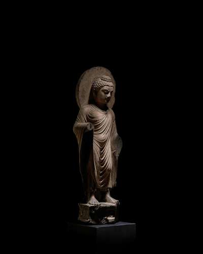 A SCHIST FIGURE OF BUDDHA ANCIENT REGION OF GANDHARA, 3RD/4T...