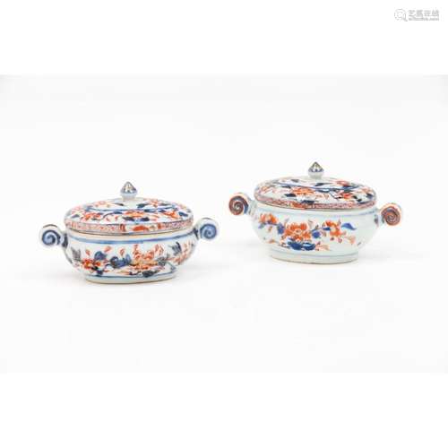 A pair of butter dishes