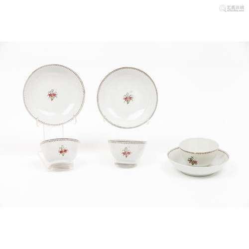 A set of three cups and saucers