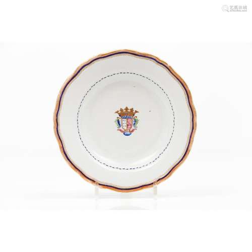 A scalloped armorial plate