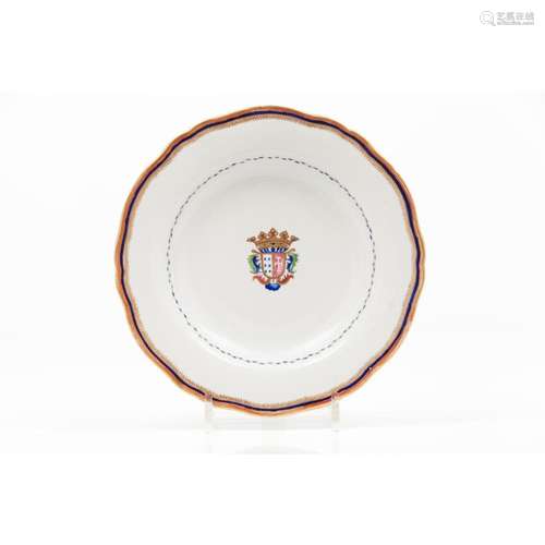 A scalloped armorial plate