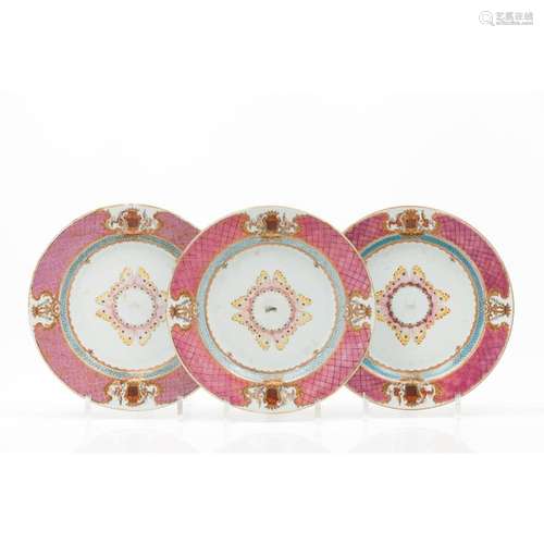 A set of three dinner plates