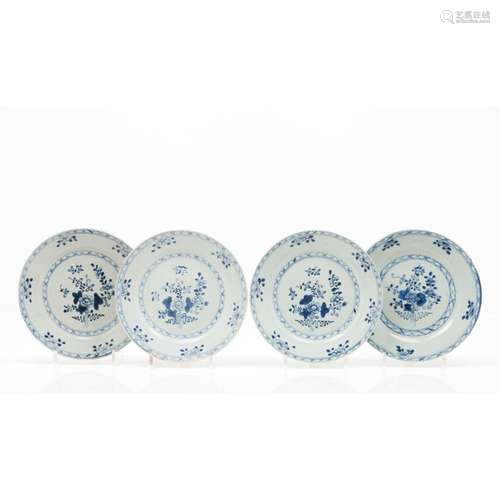 A set of four plates