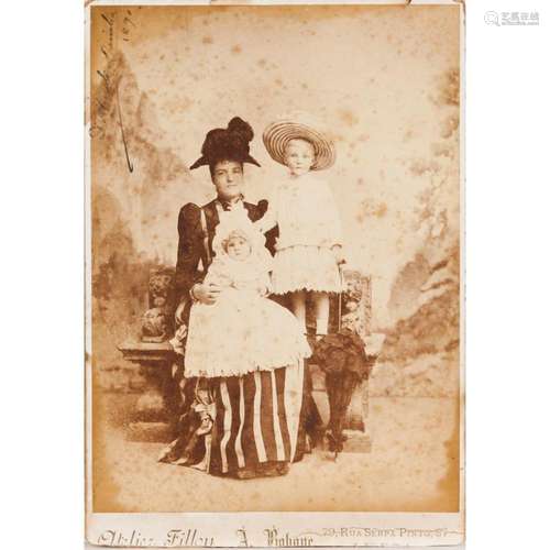 A photograph of Queen Amelia with princes Luís Filipe and Ma...