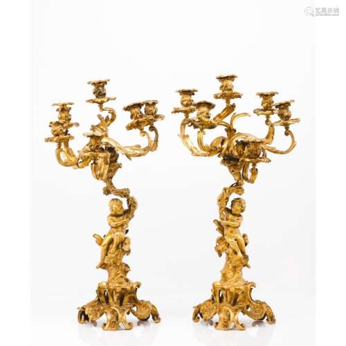A pair of six branch Louis XV style candelabra