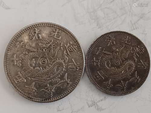 TWO CHINESE OLD SILVER COINS