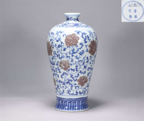 The red-wrapped plum bottle in the blue and white glaze of Y...