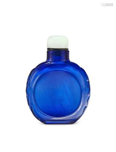 A CARVED BLUE GLASS SNUFF BOTTLE