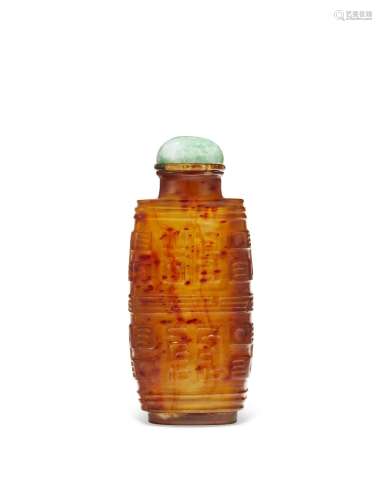A CARVED BROWN AND AMBER GLASS ARCHAISTIC SNUFF BOTTLE
