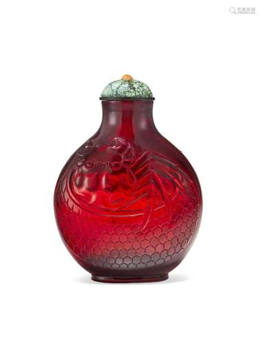 A CARVED RED GLASS SNUFF BOTTLE