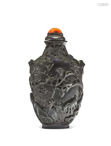 A MATTE-BLACK-ENAMELED AND MOLDED PORCELAIN SNUFF BOTTLE