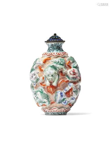 A FAMILLE ROSE ENAMELED AND MOLDED PORCELAIN SNUFF BOTTLE