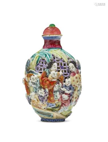 A FAMILLE ROSE MOLDED AND RETICULATED PORCELAIN SNUFF BOTTLE