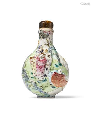 A FAMILLE ROSE MOLDED PORCELAIN SNUFF BOTTLE