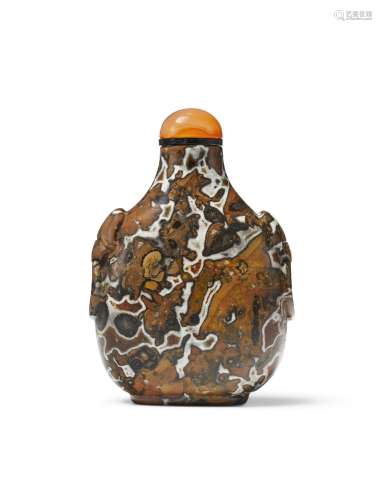 A CARVED FOSSILIFEROUS LIMESTONE SNUFF BOTTLE