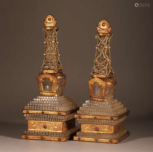 A pair of crystal gold clad relic towers