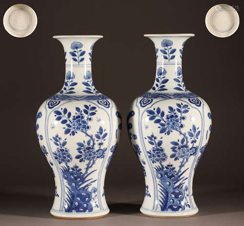 A pair of blue and white window flower bottles in Kangxi of ...