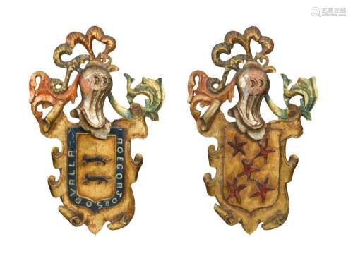 A pair of carved and painted wooden coats of arms, late 19th...
