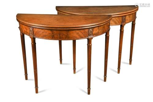 A pair of George III mahogany demi-lune card tables,