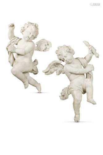 A pair of Baroque style carved and painted putti, probably l...