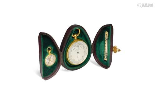 A gilt metal compensated pocket barometer with compass and t...
