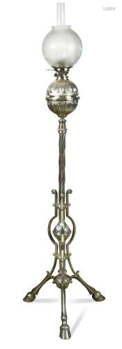 A plated standard oil lamp on tripod legs, late 19th century...