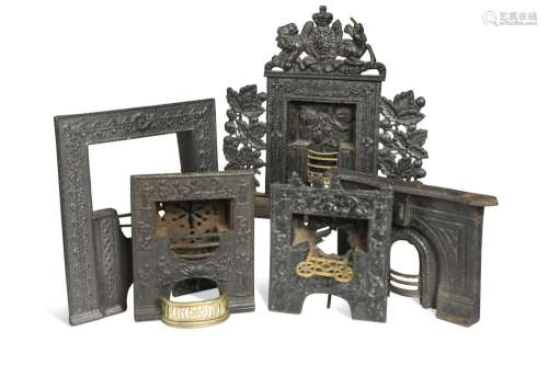 A group of five miniature cast iron and brass fireplaces, 18...