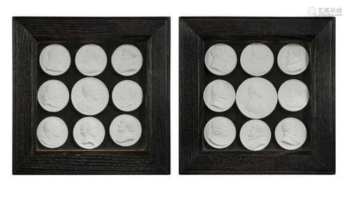 A pair of framed grand tour plaster roundel groups,