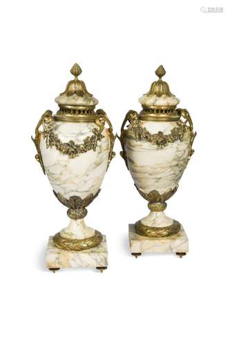 A pair of white marble and gilt metal urns and covers, 20th ...