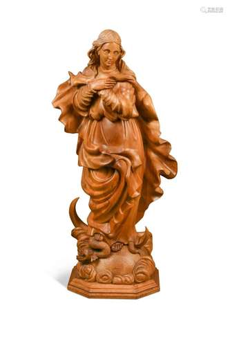 A Continental carved limewood or sycamore figure,