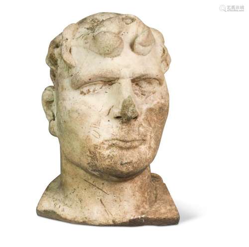 A carved marble bust of a man, possibly Roman,