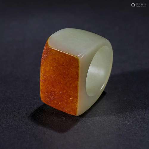 A Chinese Carved White Jade Archer Ring