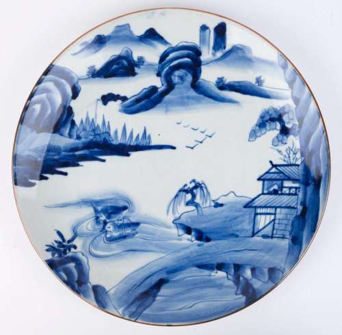 A Chinese blue and white porcelain platter with landscape sc...