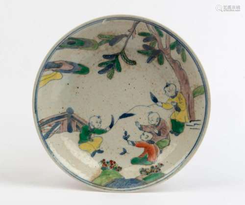 Doucai Chinese porcelain bowl decorated with boys in landsca...