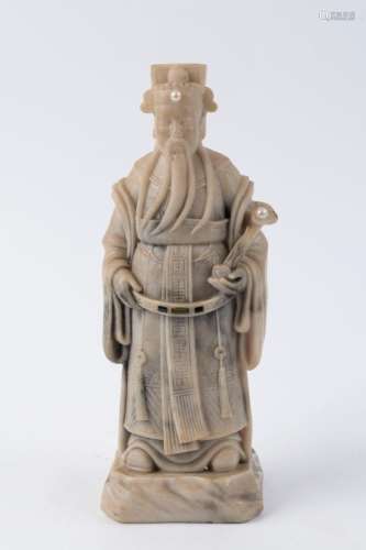 A Chinese statue of a sage, carved soapstone inlaid with pea...