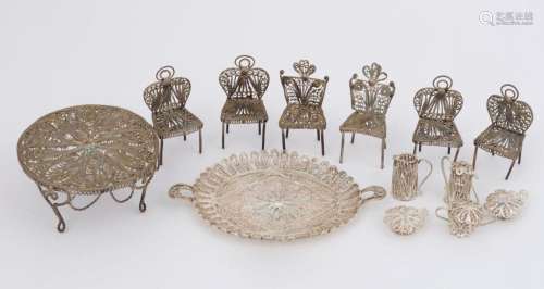 A filigree silver miniature dining setting and tea service w...