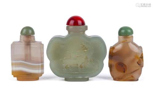 Three Chinese snuff bottles, carved agate and jade with stop...