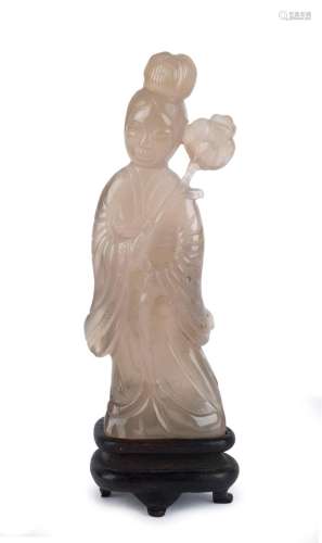 An antique Chinese carved mutton jade statue of a lady holdi...