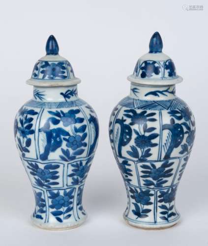 A pair of antique Chinese blue and white porcelain lidded va...