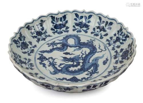 A Chinese lotus shaped porcelain serving bowl with dragon de...