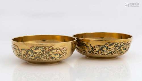 A pair of Chinese brass finger bowls with dragon motifs, lat...
