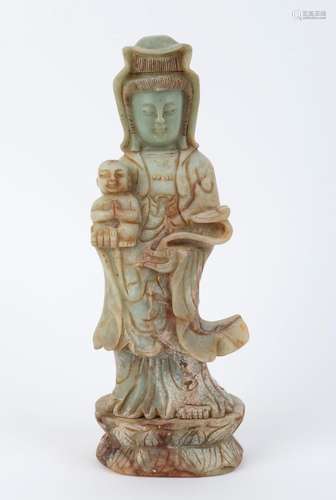 A Chinese carved jade Guanyin with child statue, 19th/20th c...